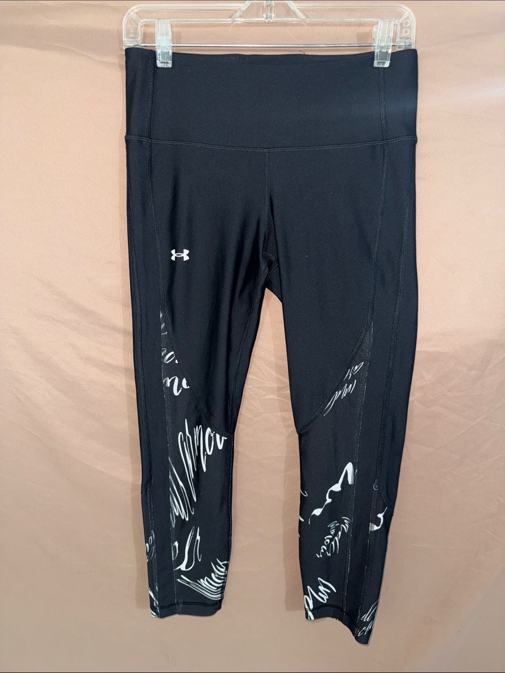 Women’s Medium Under Armour Black Capri Leggings with White Script Accents